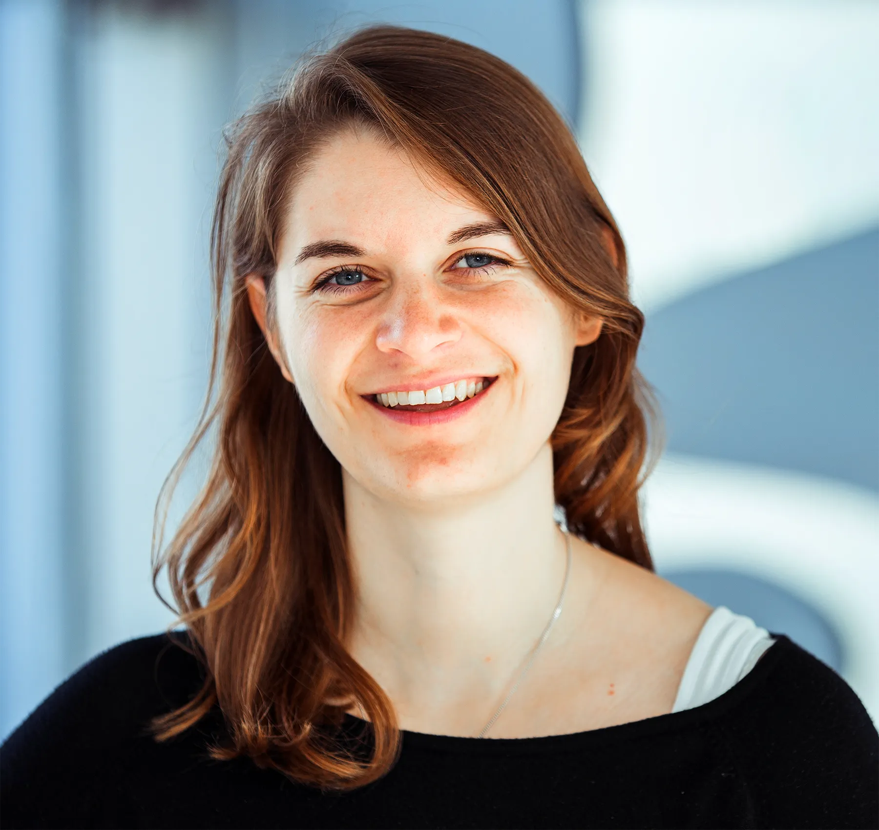 Headshot of Jana Lieberz against a blurry background.