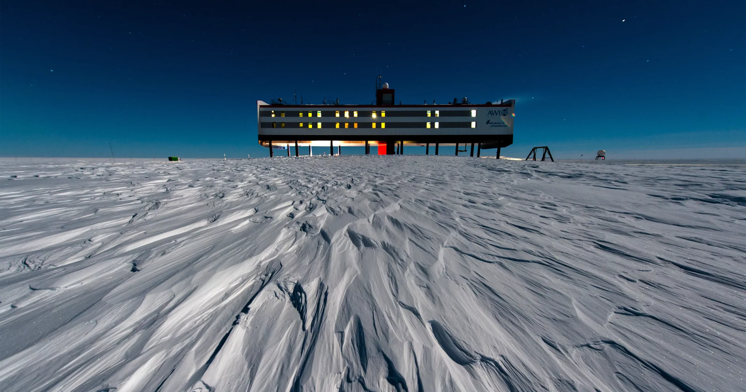 The Neumayer III polar research station standing on the windswept ice of Antarctica.