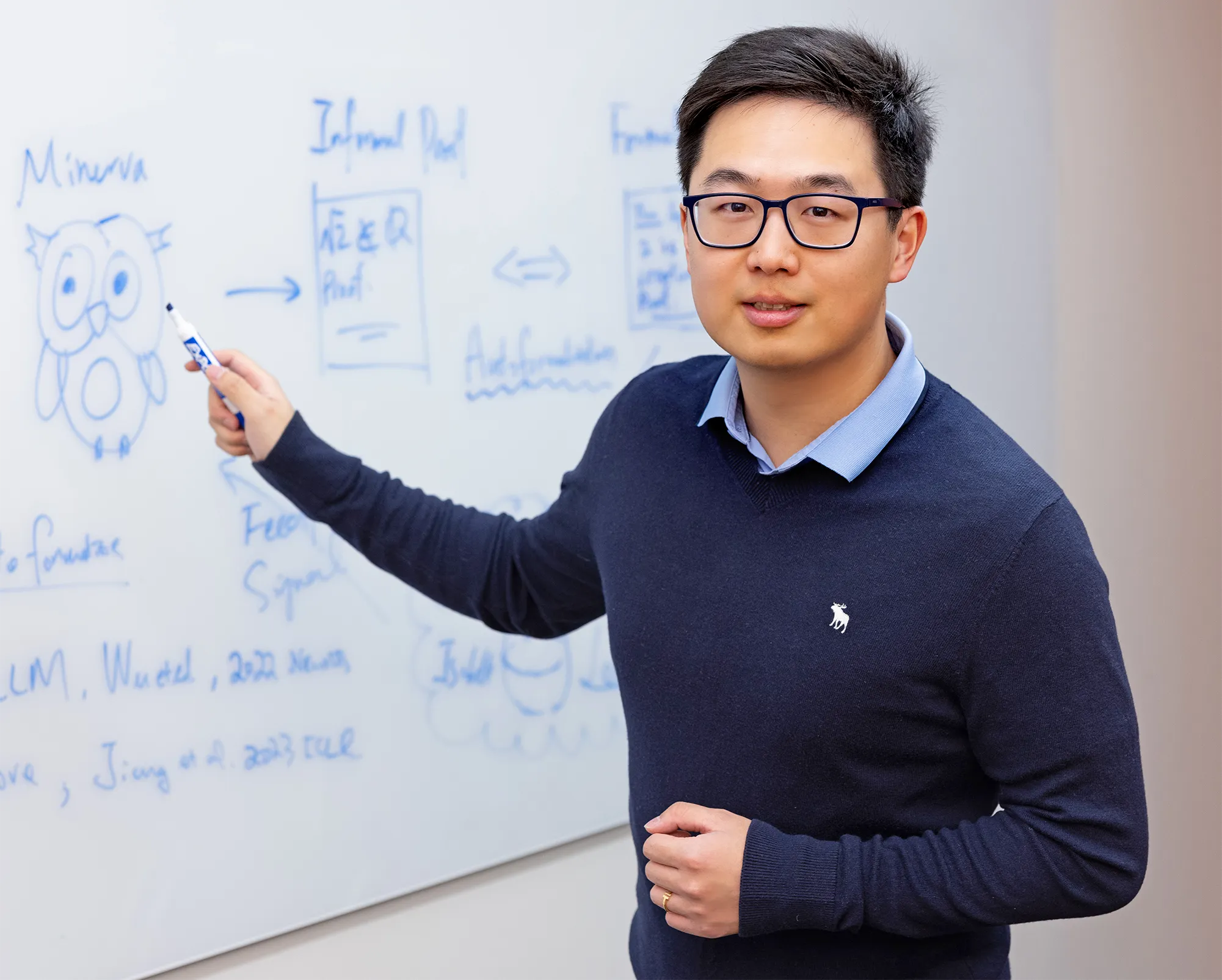 Yuhuai (Tony) Wu in front of a whiteboard with math written on it