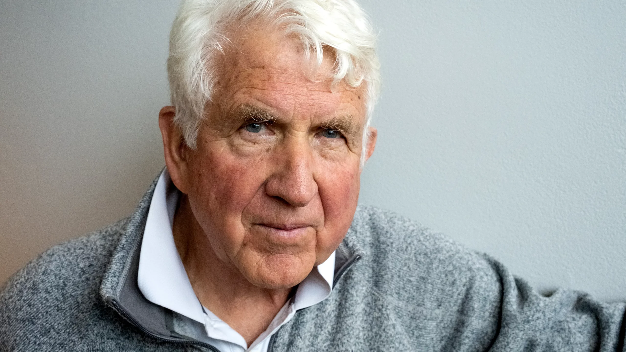 Bob Metcalfe in a gray sweater with a white background.