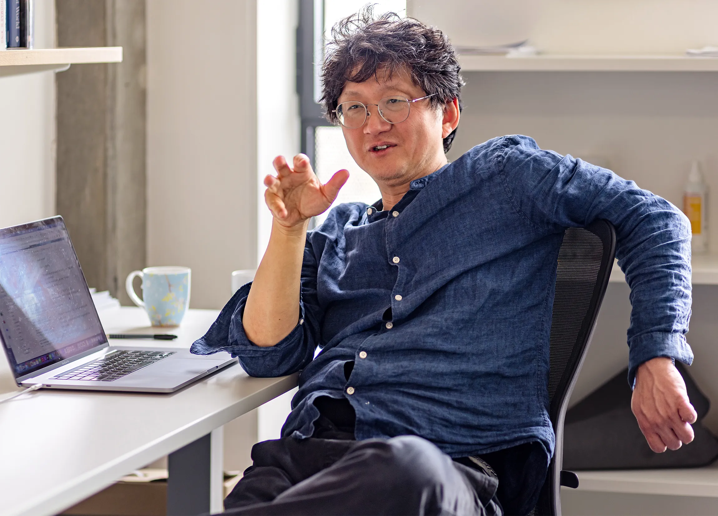 A man sitting at a desk.