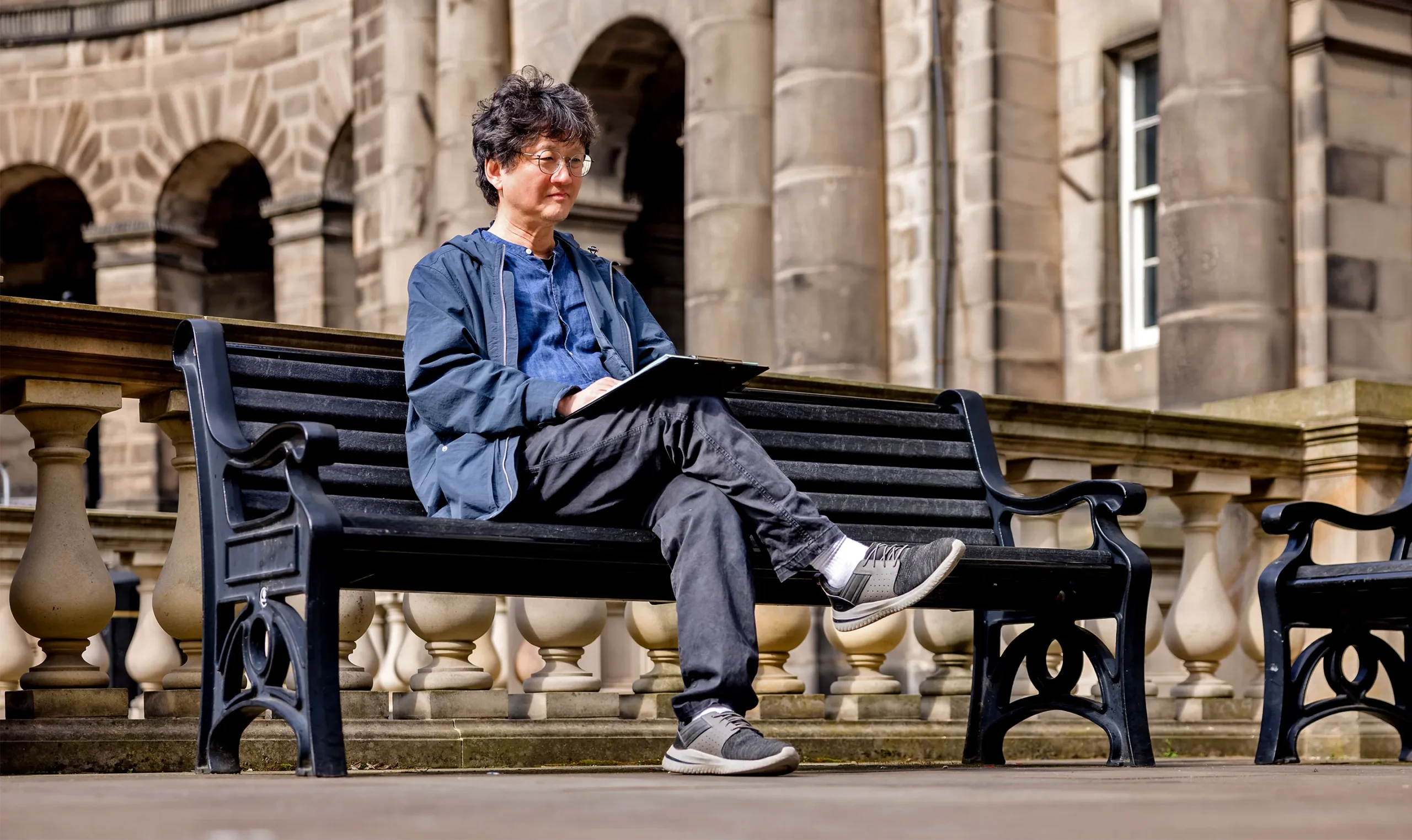 A man sitting on a bench.