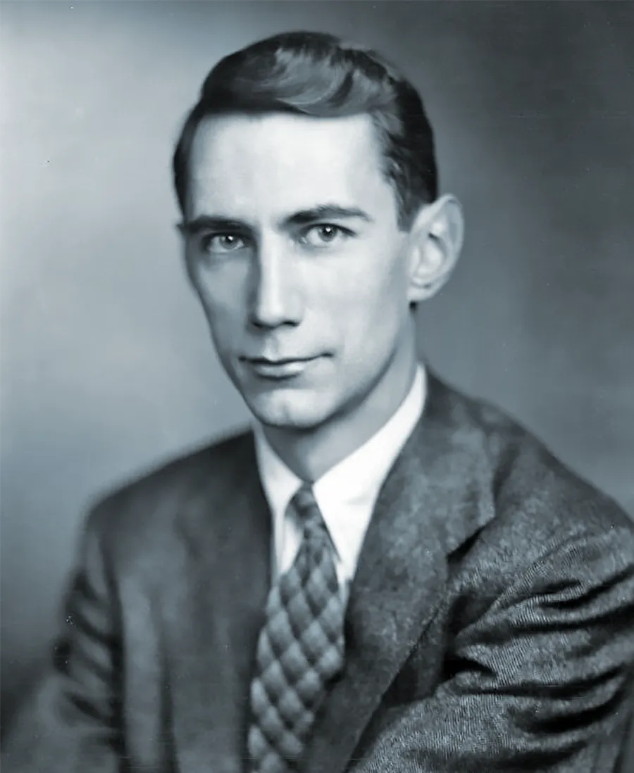 Black-and-white photograph of Claude Shannon in a suit.