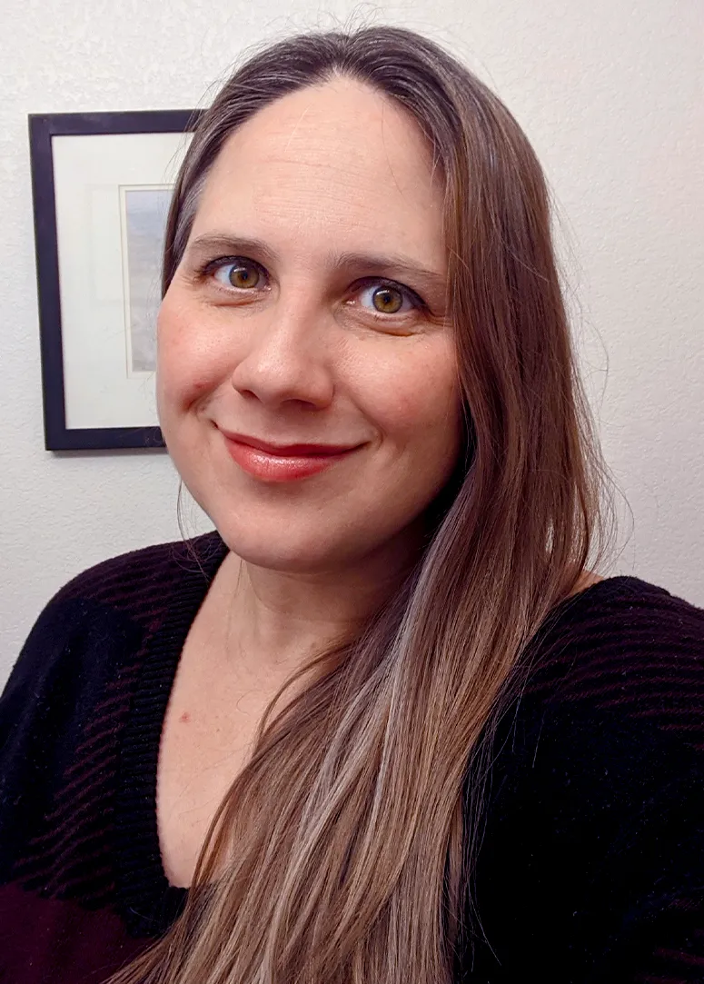 A headshot of Upton. She is smiling and wearing a black shirt.