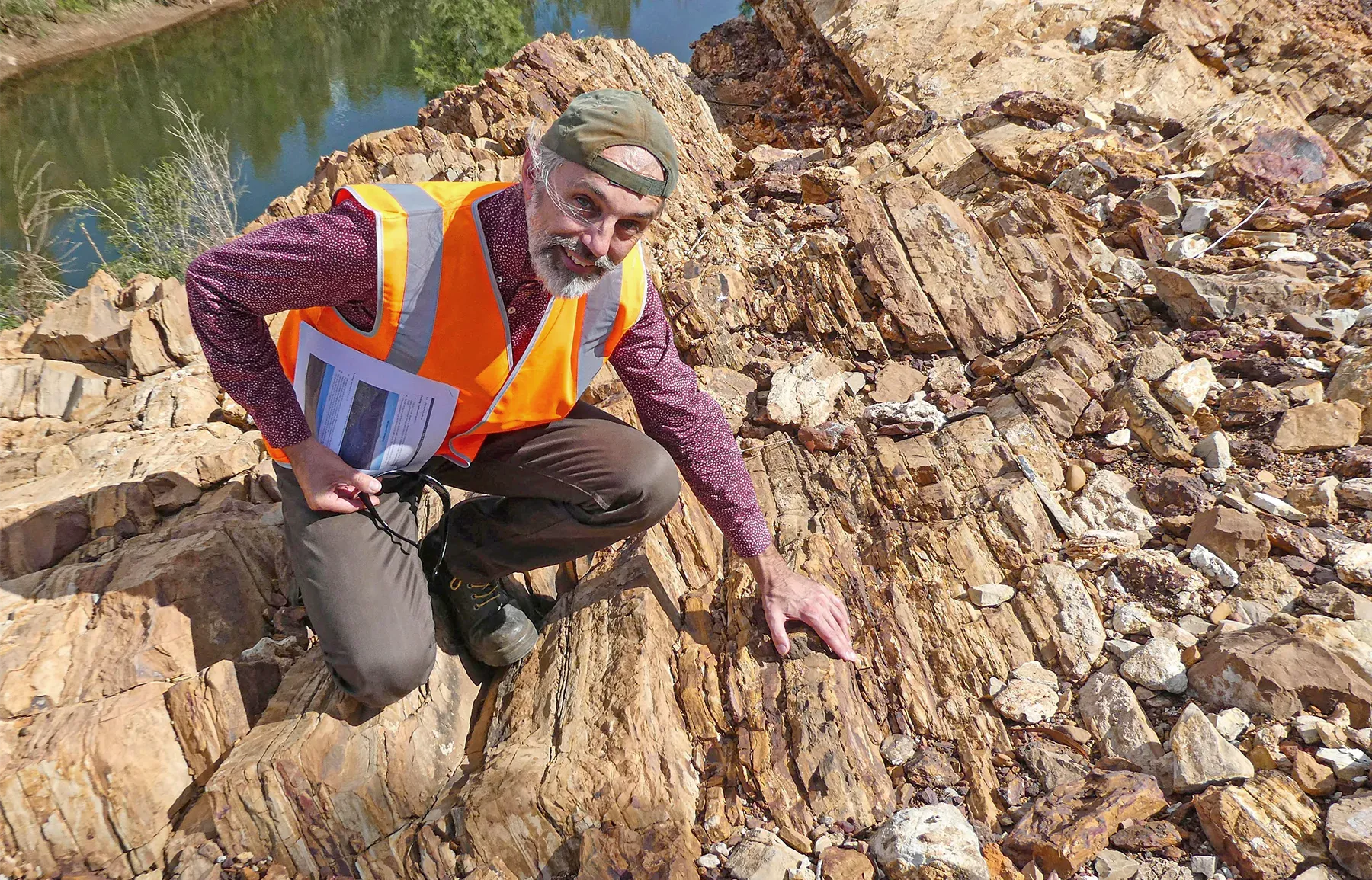 Jochen Brocks poses in front of ancient rocks, estimated to be 1.64 billion years old, in northern Australia.