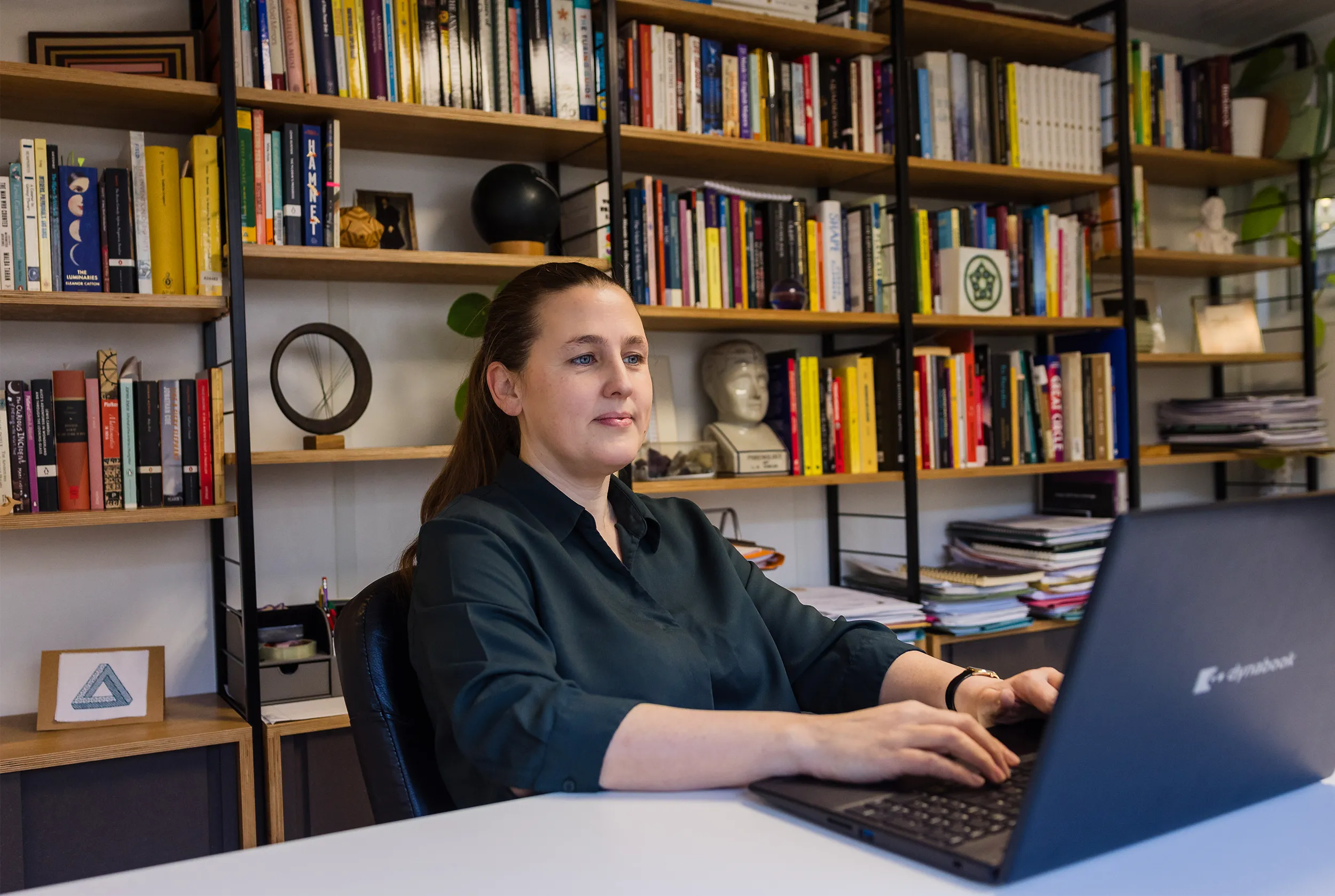 Mathematician Sarah hart typing on a laptop computer.