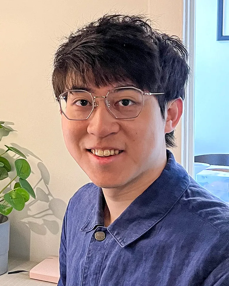 Robert Huang in a blue shirt.