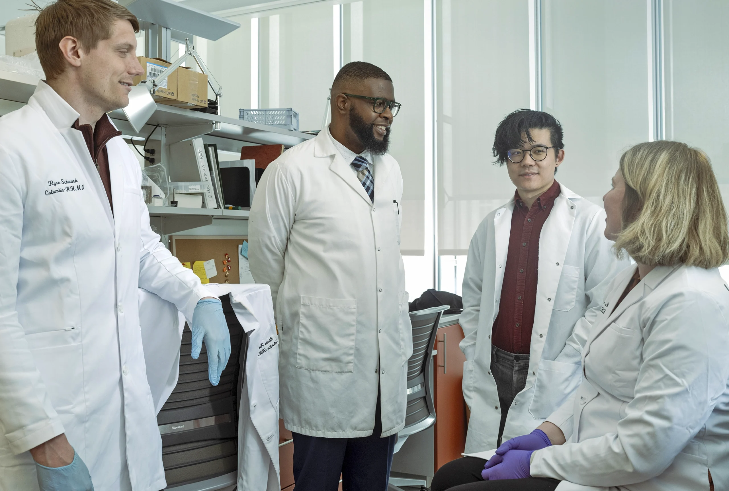 The neuroscientist Ishmail Abdus-Saboor in conversation with three colleagues from his laboratory at the Zuckerman Mind Brain Behavior Institute.