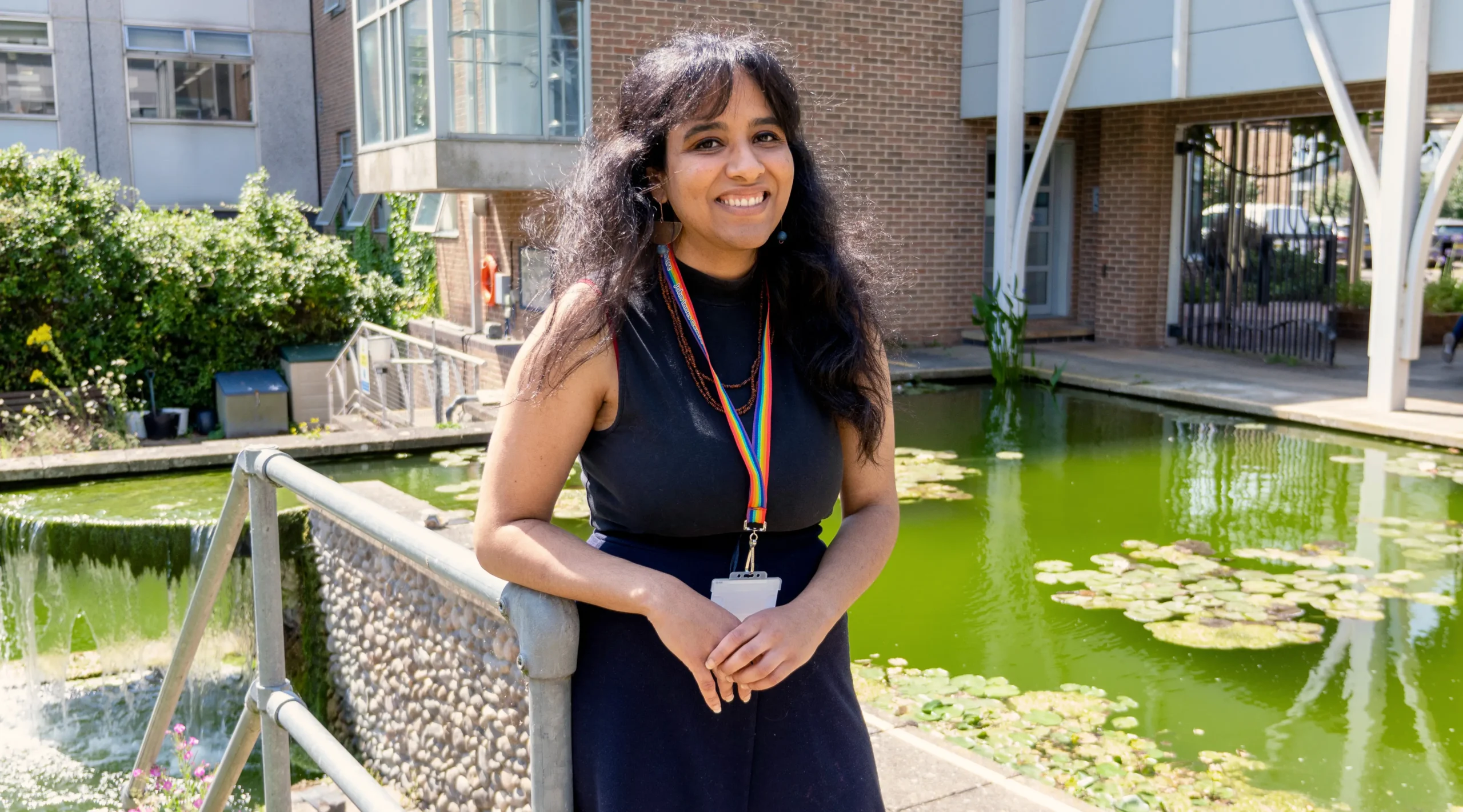 Luísa Jabbur standing by a pond near the John Innes Centre, which very conveniently at the time had a bit of an algal bloom going on.