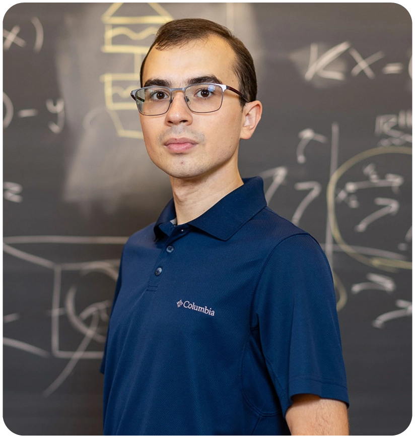 A man in front of a chalkboard