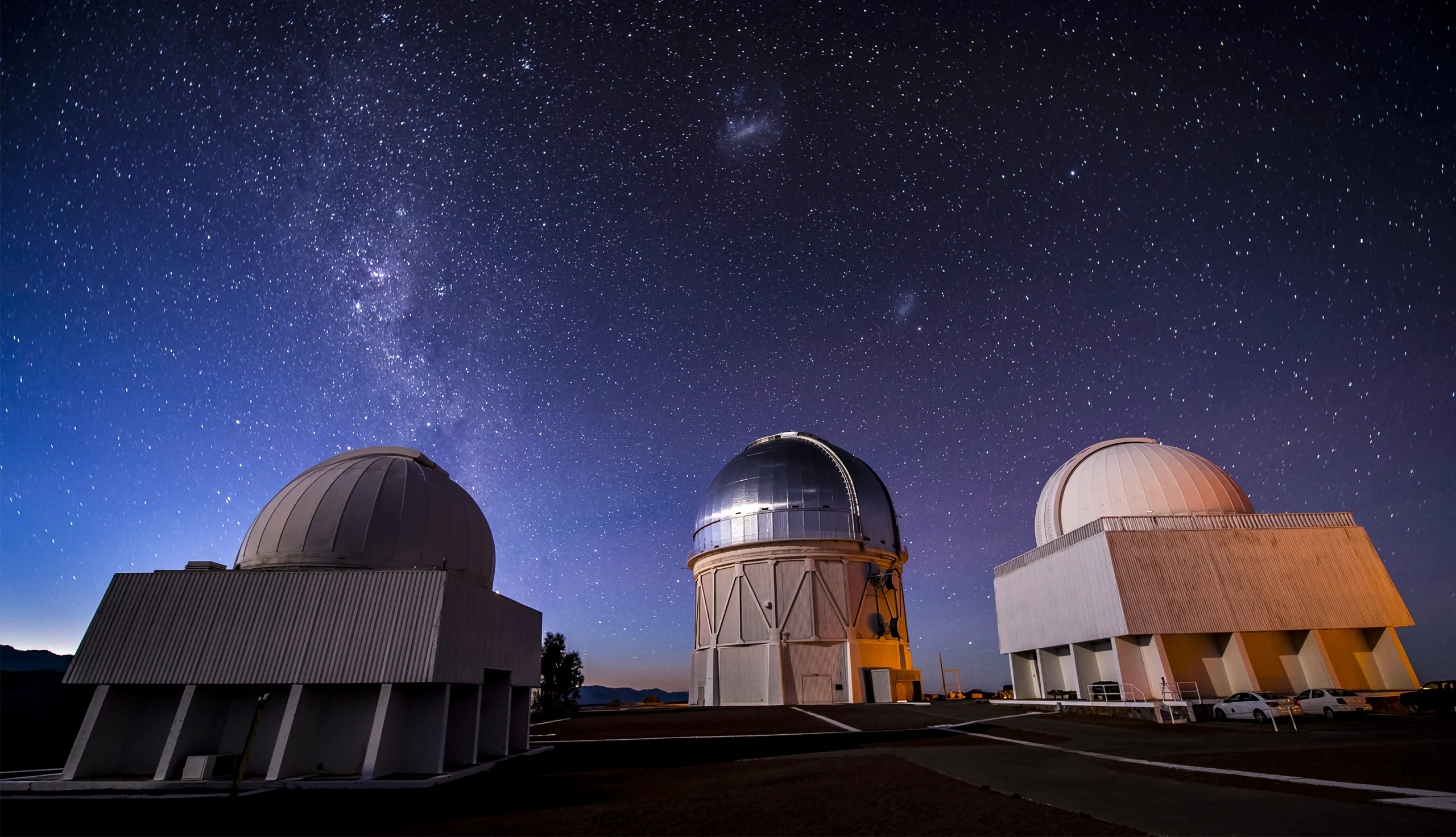 A telescope against the backdrop of the night sky.